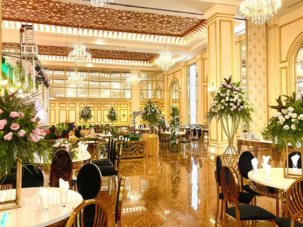 Luxury event décor with draped fabric and flowers Lahore