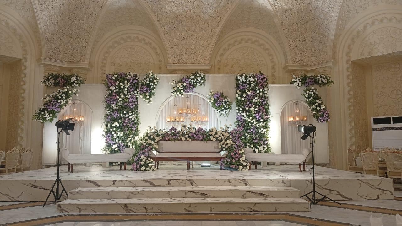 Grand bridal stage setup with floral backdrop Lahore