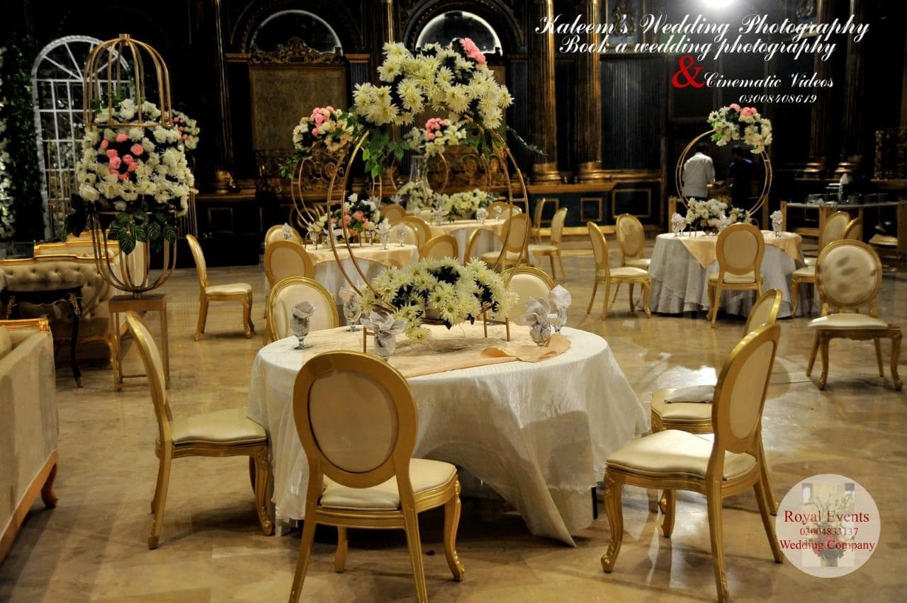 Themed event decoration with lighting and flowers by H&K